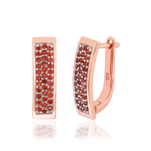 Серебряные серьги в позолоте с красными фианитами